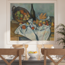 Jitterbug's wallpaper mural of Paul Cezanne's painting, A Basket of Apples, hangs on the wall of a dining area.