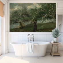 Jitterbug’s wallpaper mural of Winslow Homer's painting, Girl Picking Apple Blossoms hangs on the wall over a bathtub.