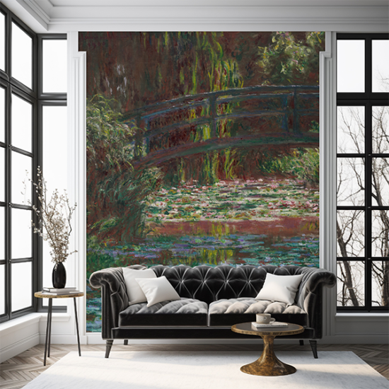Jitterbug's wallpaper mural of Claude Monet's painting, Water Lily Pond, hangs in a room behind a sofa.