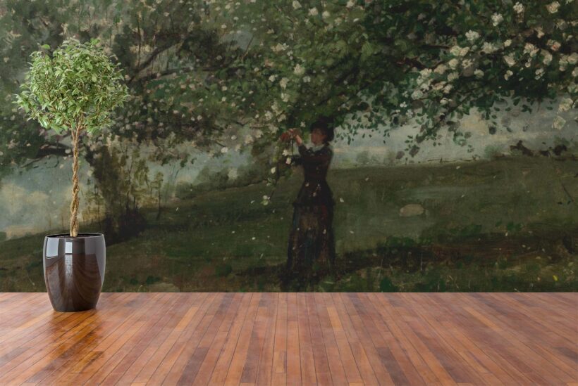 Jitterbug’s wallpaper mural of Winslow Homer's painting, Girl Picking Apple Blossoms hangs on the wall.