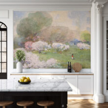 Jitterbug’s wallpaper mural of Cherry Blossoms by William Henry Holmes hangs on a wall.