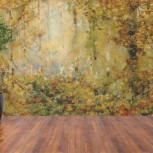 Jitterbug's walllpaper mural of William Henry Holme's painting, Autumn Tangle hangs on a wall.
