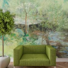 Jitterbug's wallpaper mural of John Henry Twachtman's painting, White Bridge, hangs on the wall of a white living area.