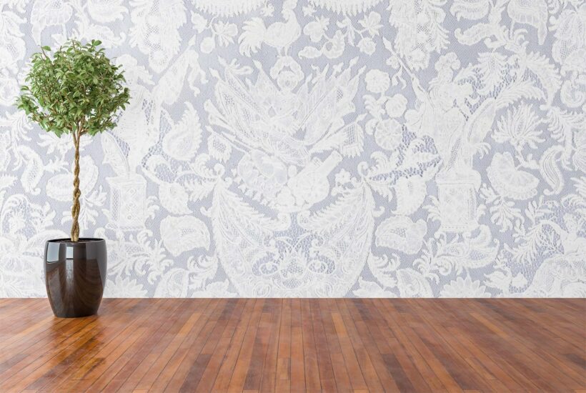 Jitterbug's wallpaper mural of 18th c. Cravat End Flemish lace hanging on a wall.